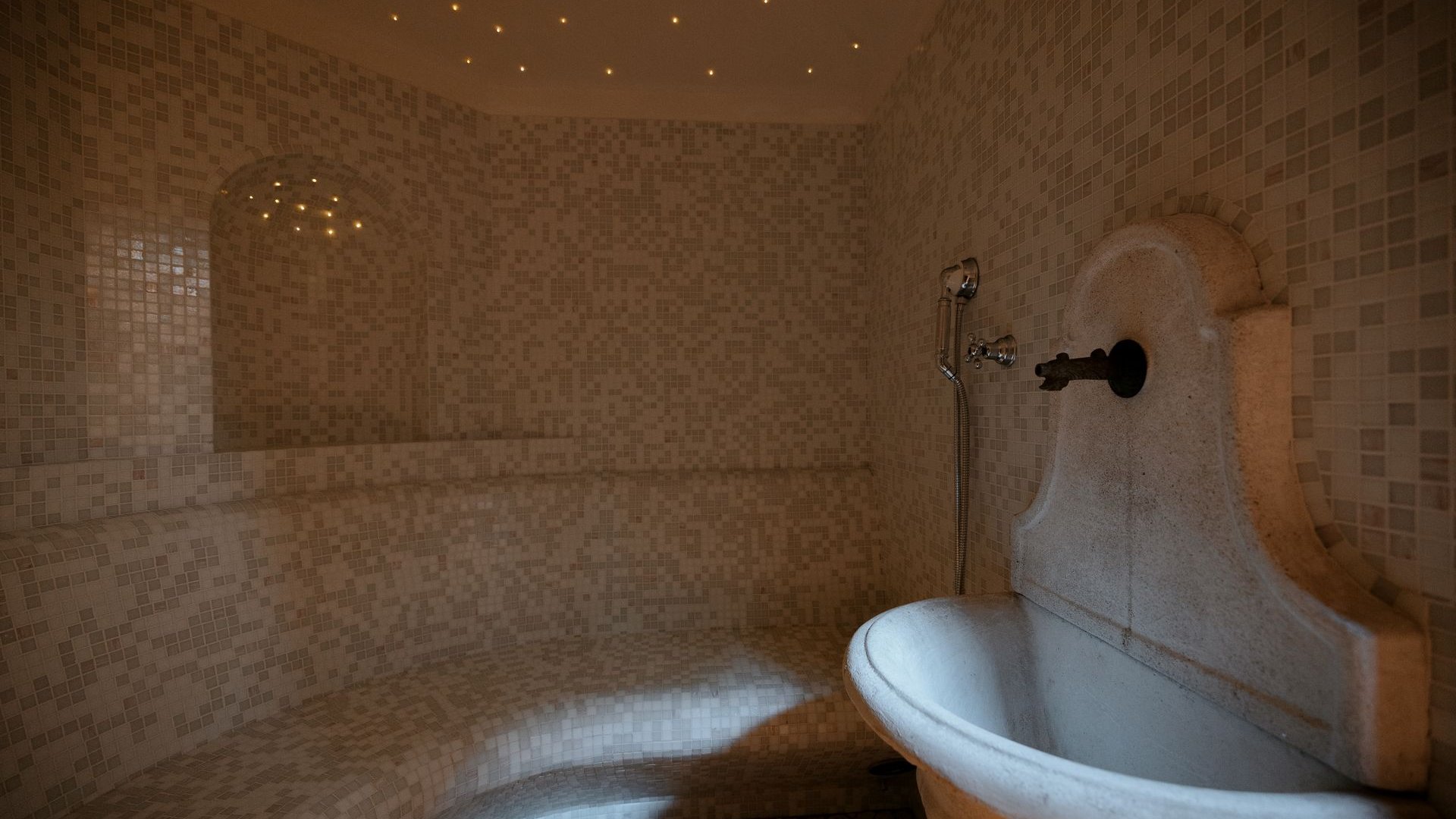 South Tyrol hotel with pool (3 stars): right here! Interior of a steam room with mosaic tiles and a water faucet