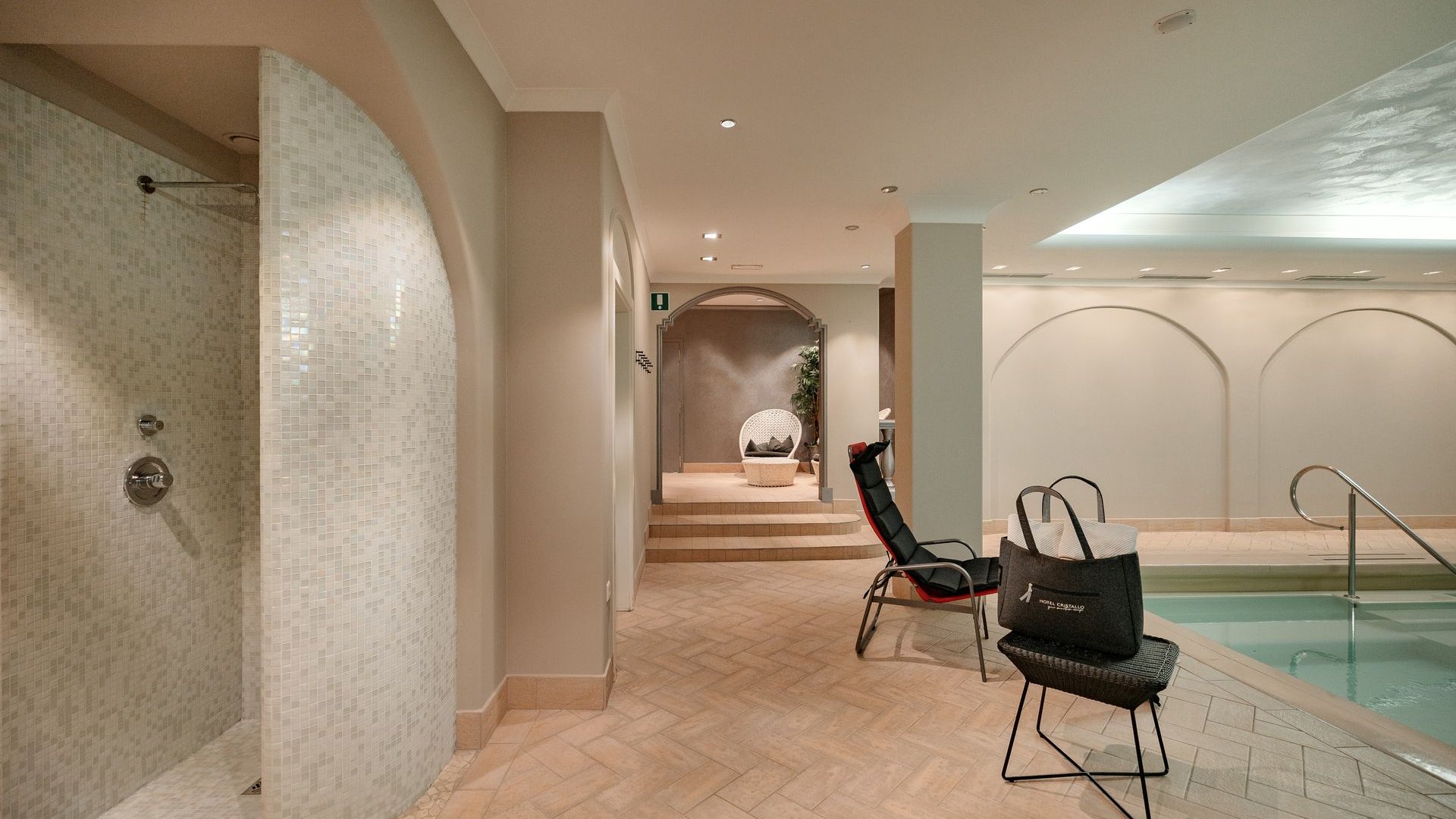 South Tyrol hotel with pool (3 stars): right here! Modern wellness area with shower, lounge chair, and small pool